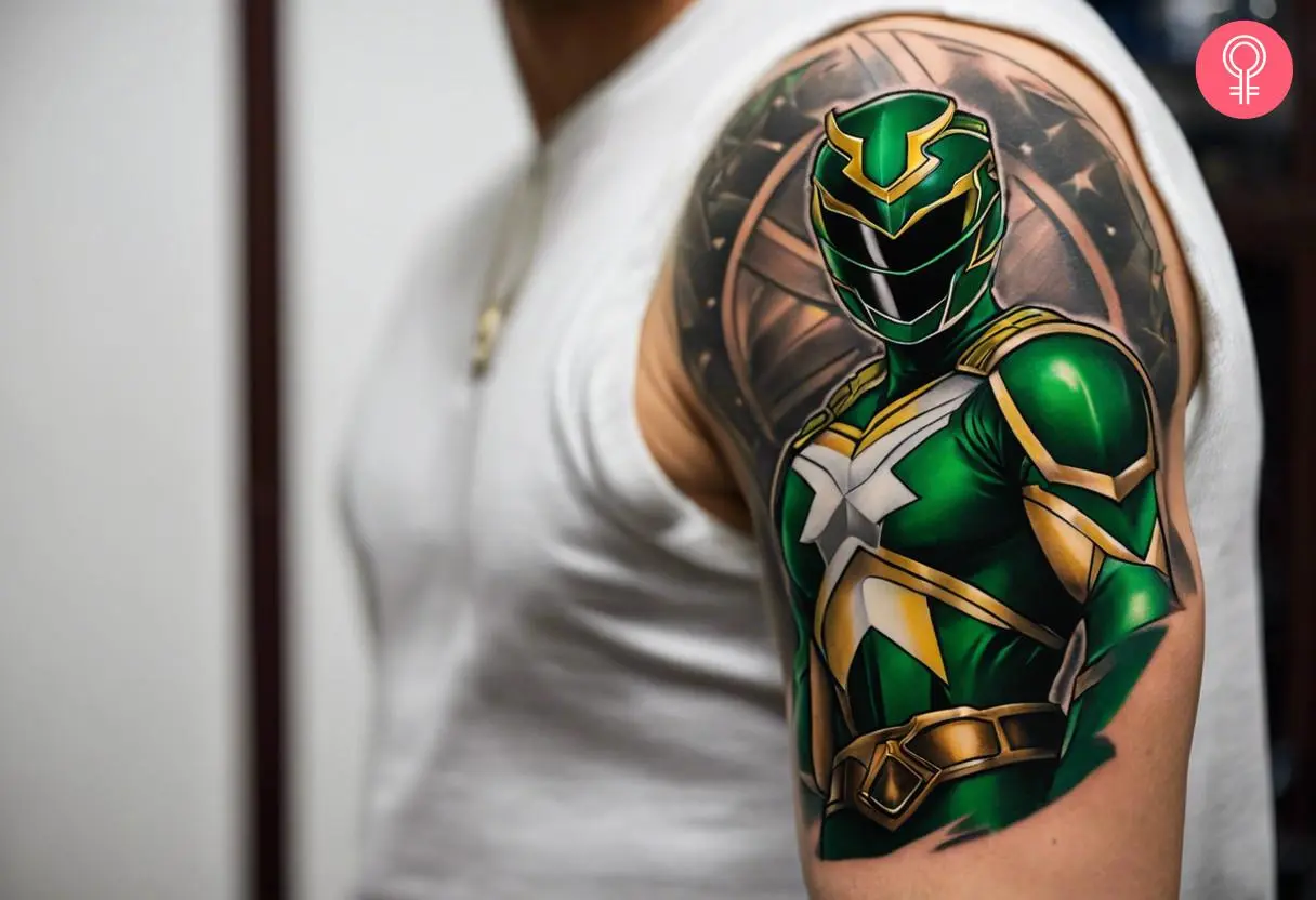 A modern green Ranger tattoo on the upper arm