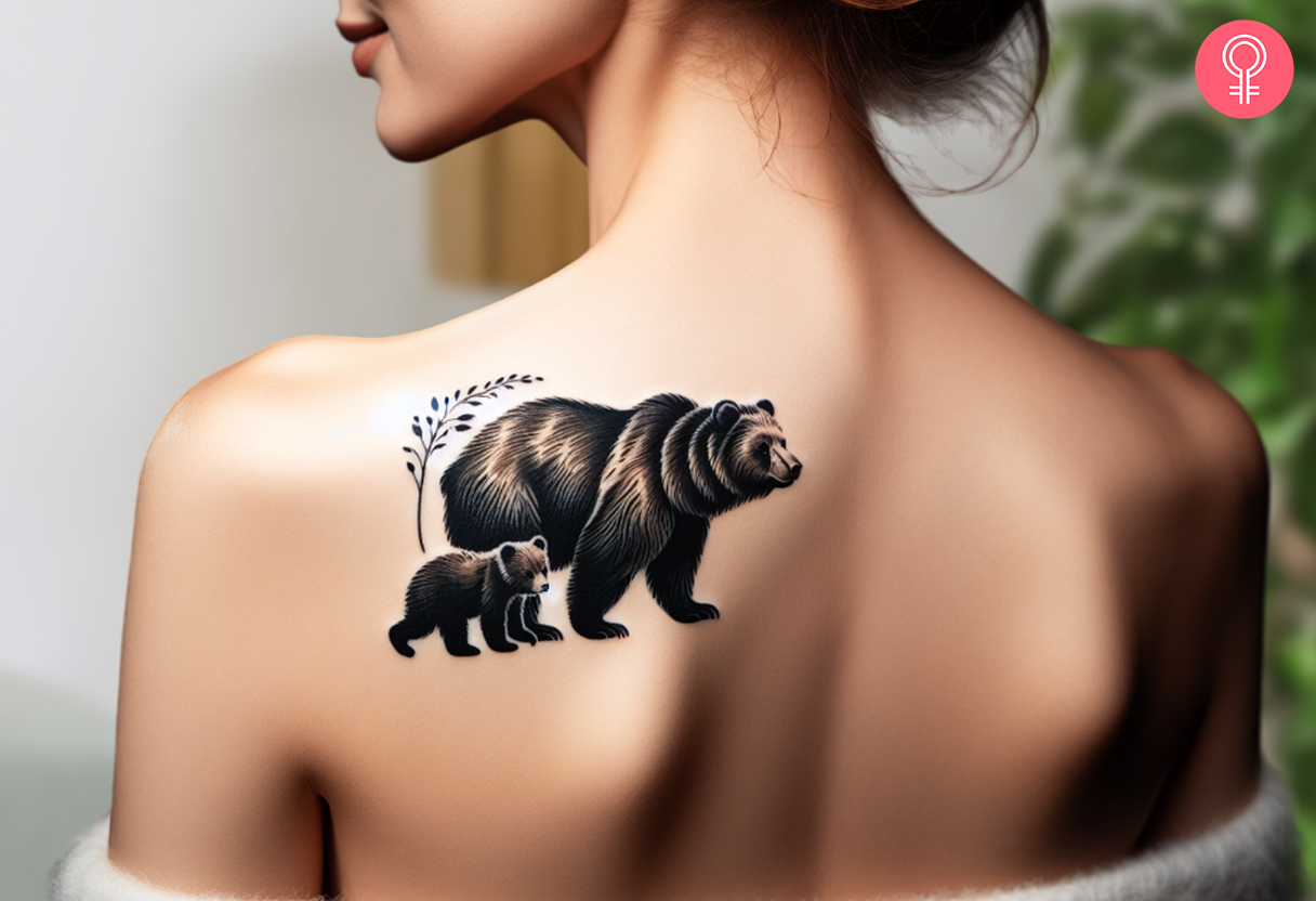 Woman with grizzly bear and cub tattoo on her upper back