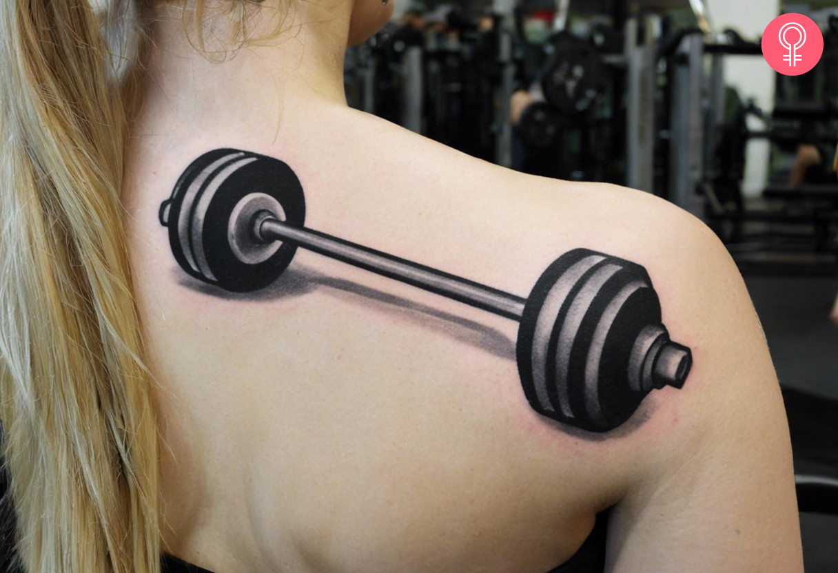 Gym barbell tattoo on the shoulder