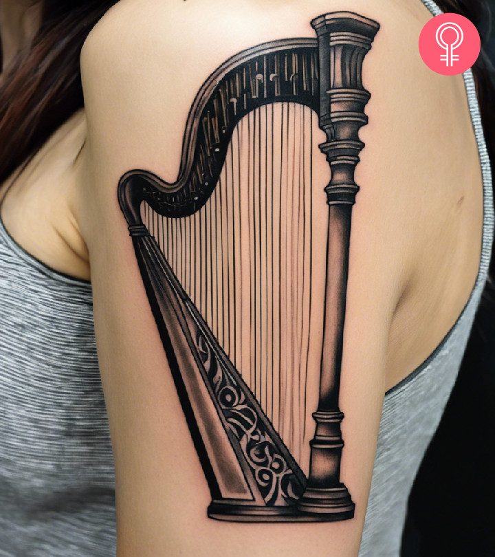 Harp tattoo on the upper arm