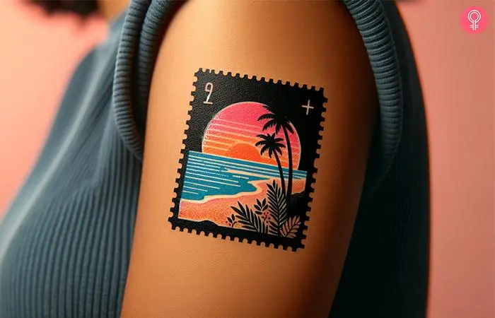 A woman wearing a Hawaii postage stamp tattoo on the upper arm.