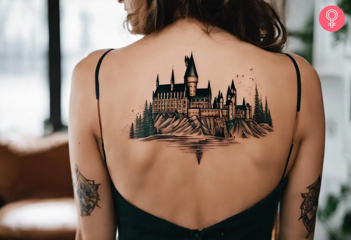 A woman with a Hogwarts tattoo on her back