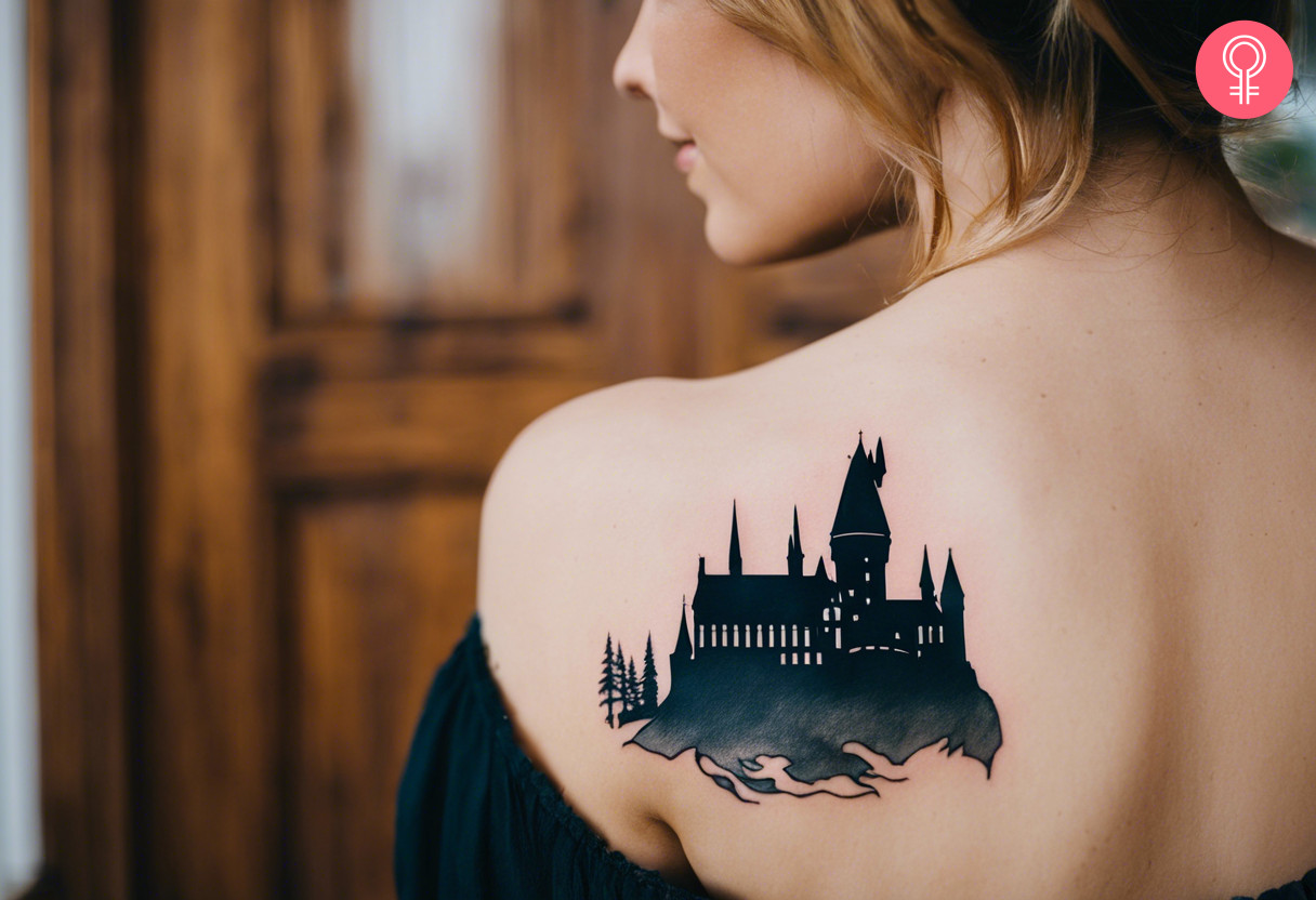 A woman with a Hogwarts silhouette tattoo on her shoulder