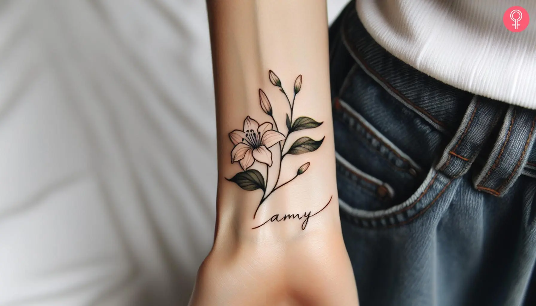 Honeysuckle with the name Amy tattooed on the wrist