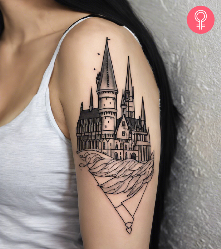 A woman flaunting Hogwarts castle tattoo on her arm