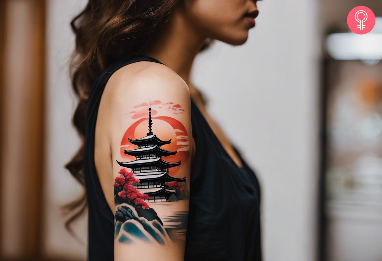 A woman with a vibrant Japanese scenery tattoo on her upper arm