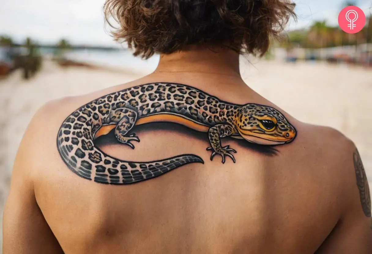 Leopard gecko tattoo on a man’s upper back