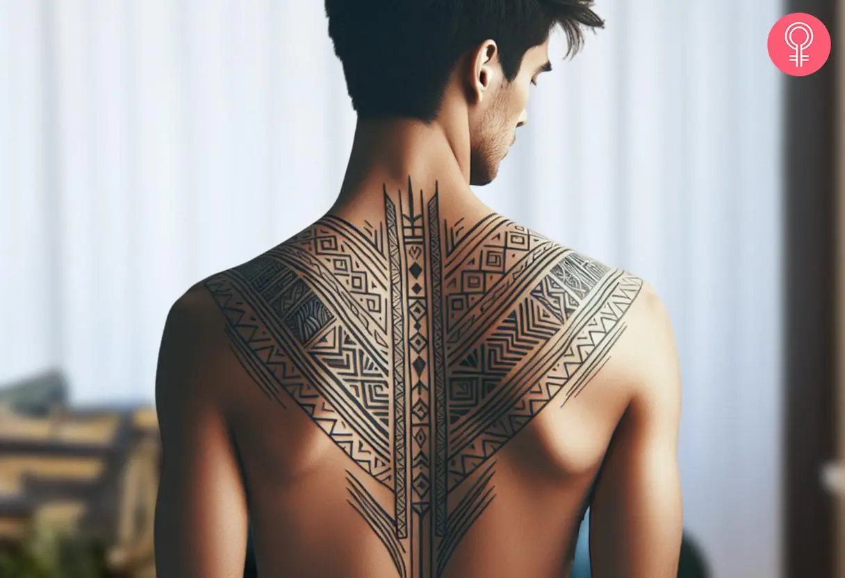 Man with a Kalinga upper back tattoo.