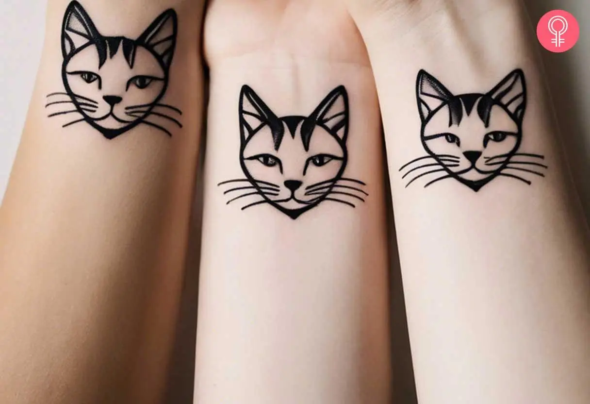 Matching cat tattoos on the wrist