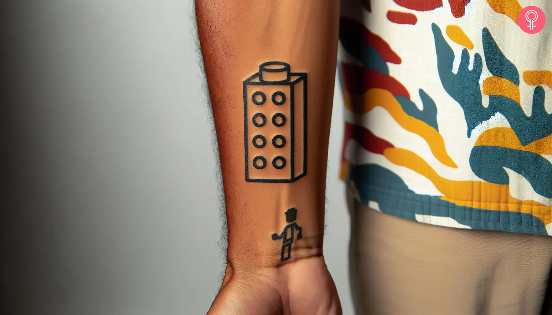 A lego brick tattoo on the wrist