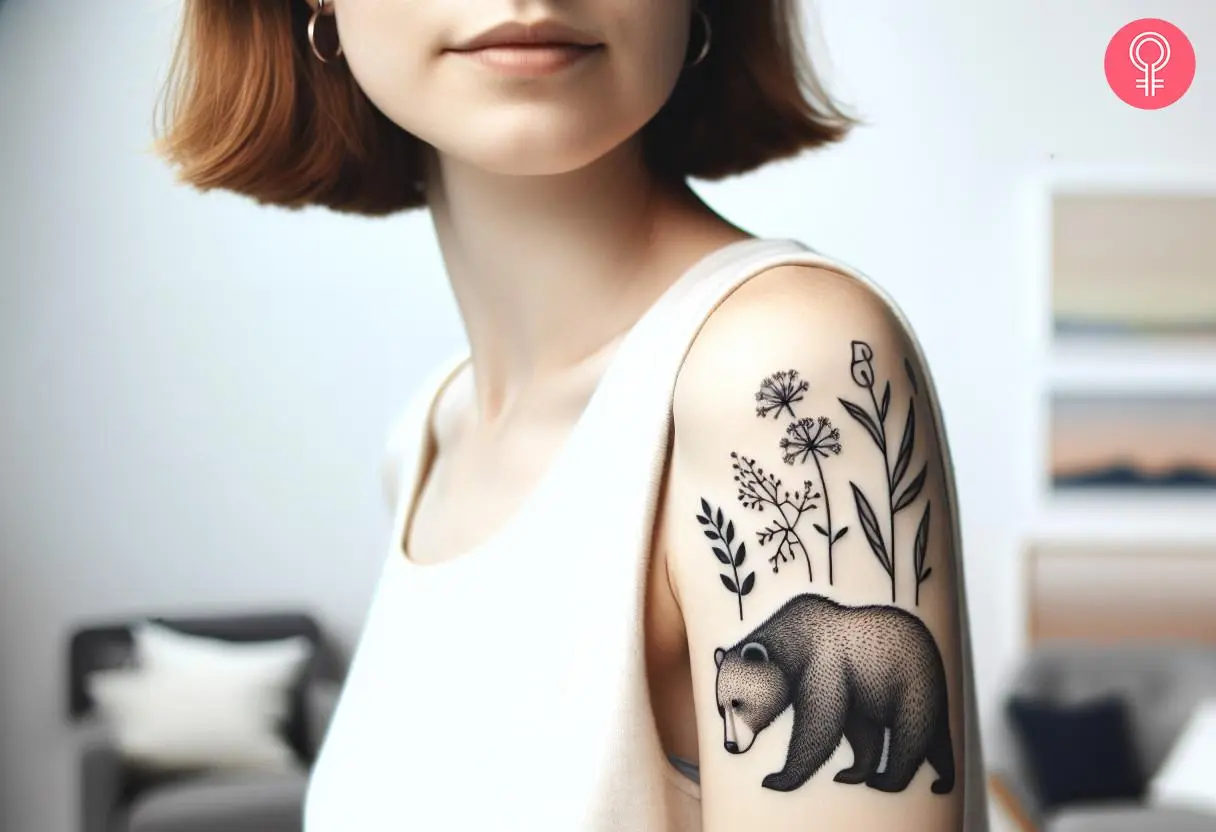 A woman with a black mama bear tattoo on her upper arm