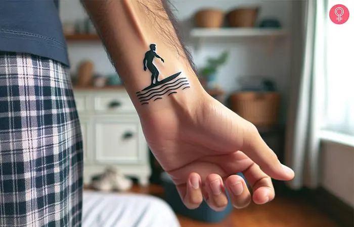 Man with a minimalist surf tattoo on the wrist