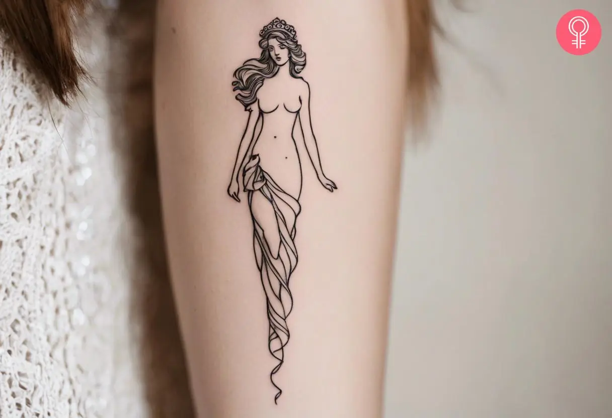 Minimalist Venus tattoo on a woman’s arm