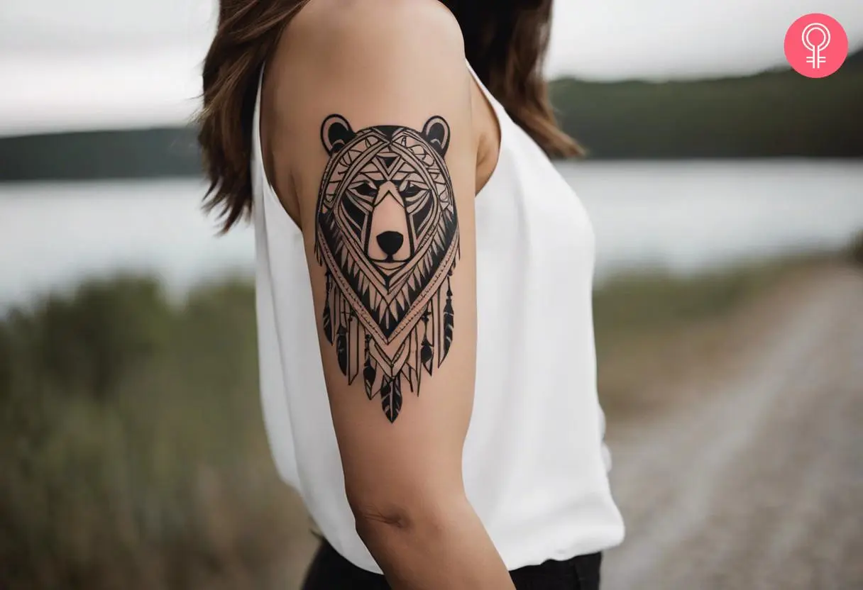 Native American tribal bear tattoo on the upper arm