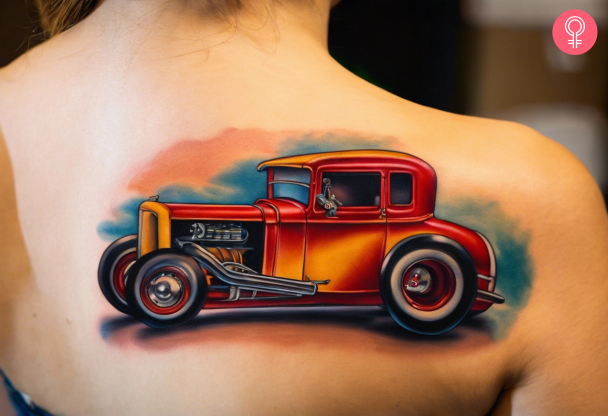 A woman with a new school hot rod tattoo on her back