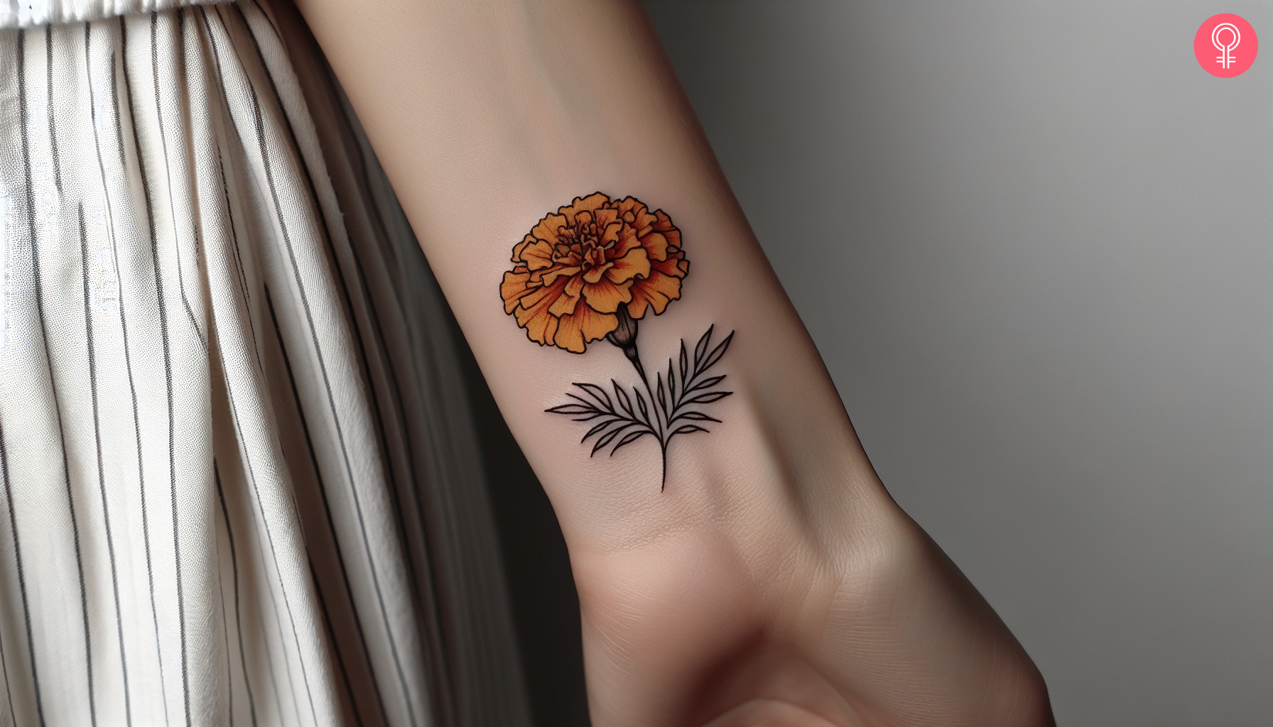 A minimalist marigold flower inked on the wrist