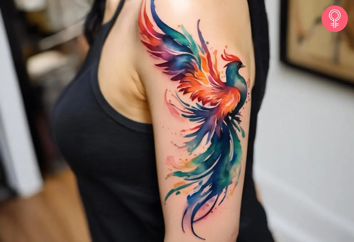 Phoenix rising tattoo on a woman’s arm