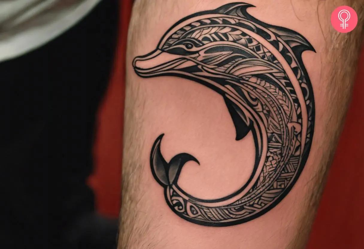 Polynesian dolphin forearm tattoo