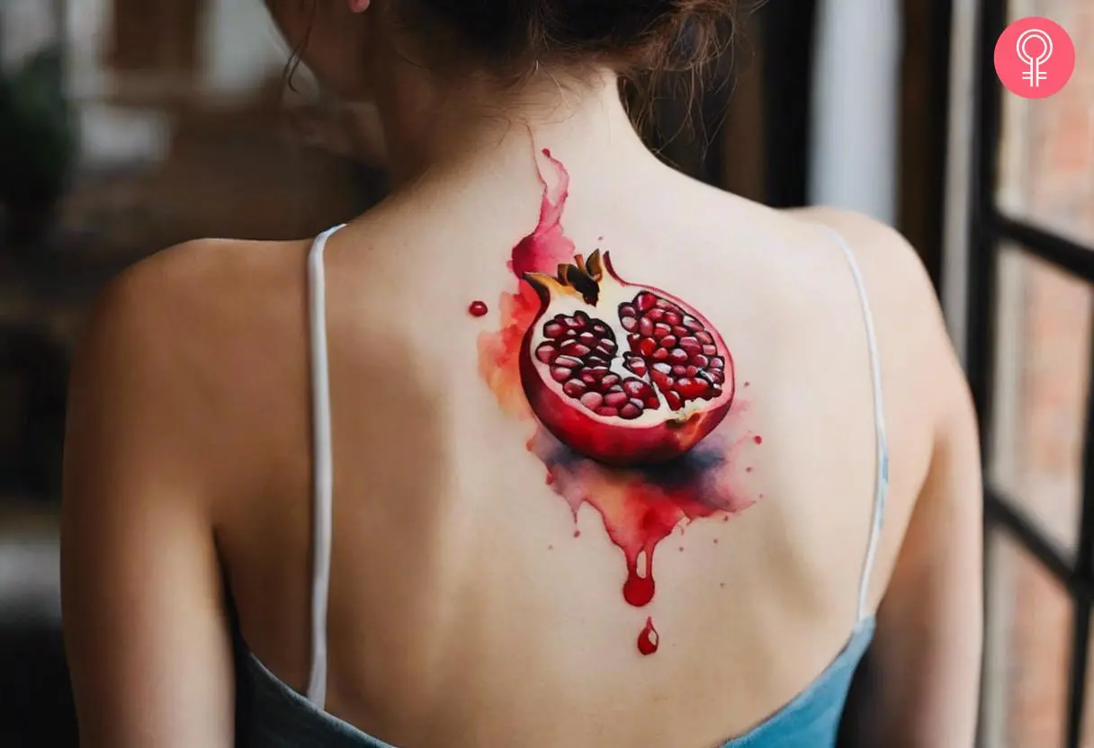 Pomegranate tattoo on the back