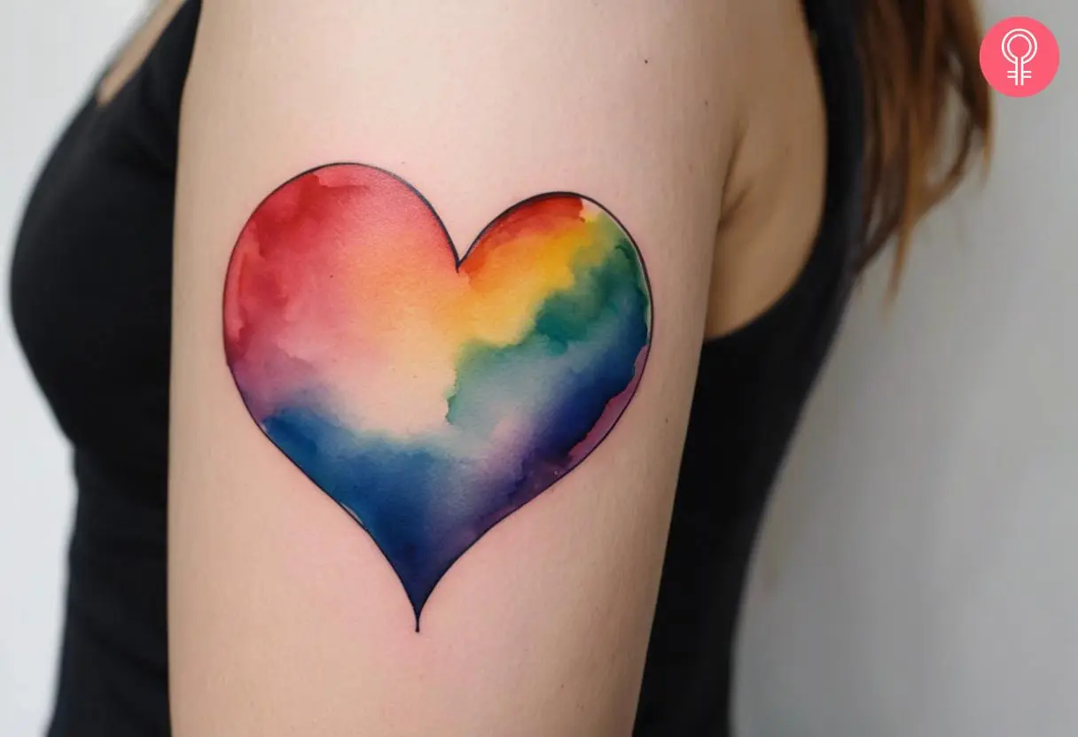 Rainbow heart tattoo on a woman’s arm