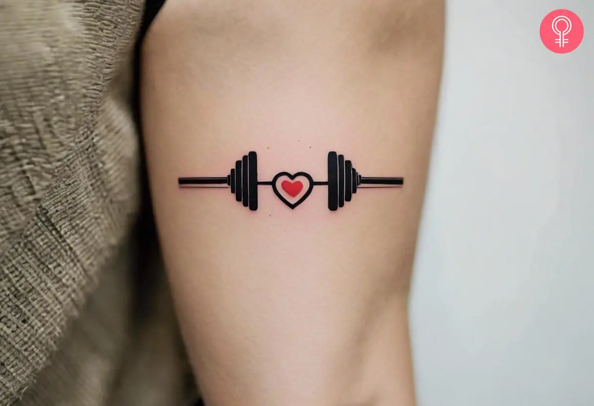 Barbell and heart fitness tattoo for females