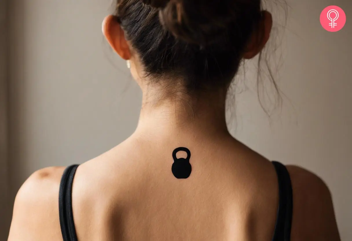 Silhouette small kettlebell tattoo on the back