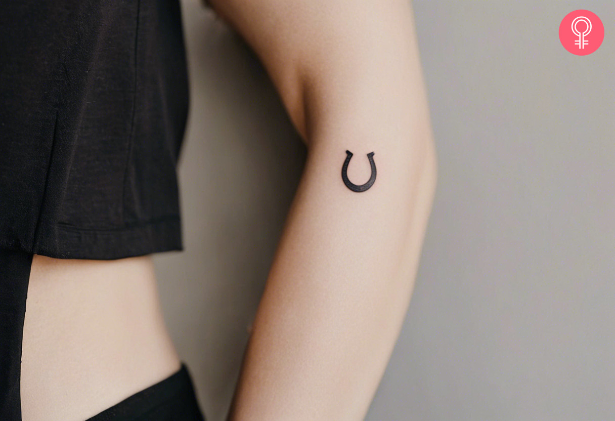 Small horseshoe tattoo on the arm