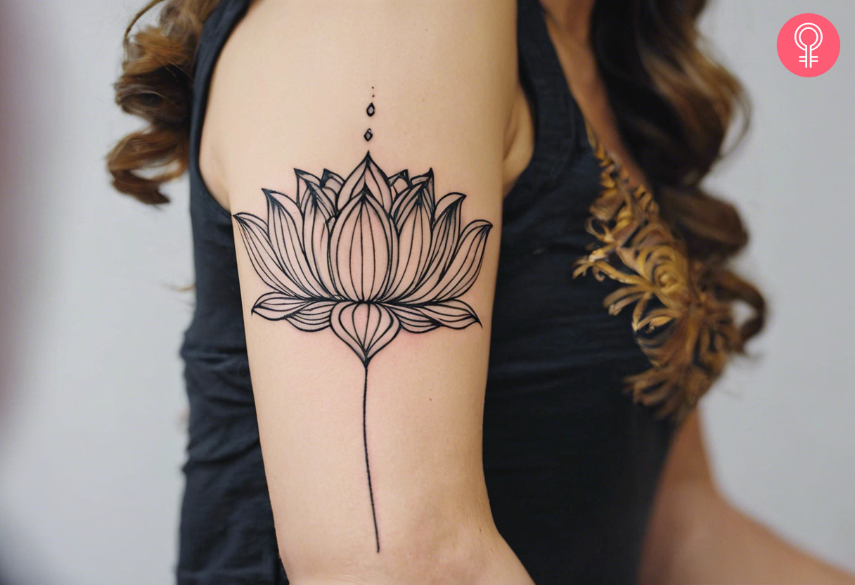 Woman with strength flower tattoo on her outer arm