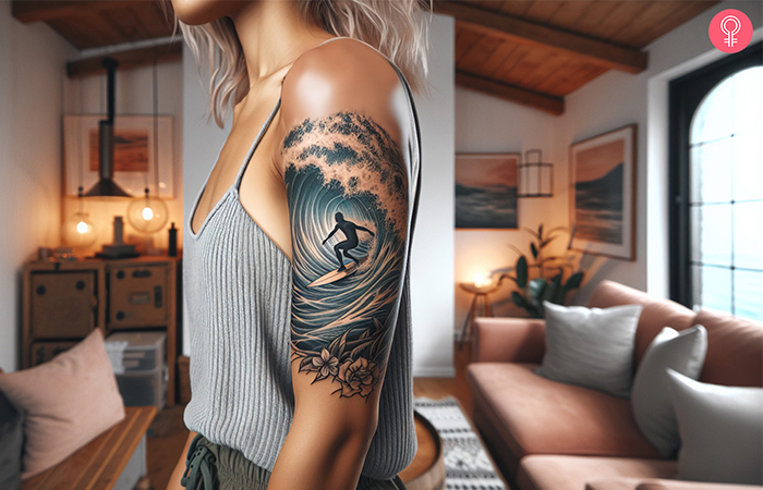 Girl with a surfer tattoo on the upper arm