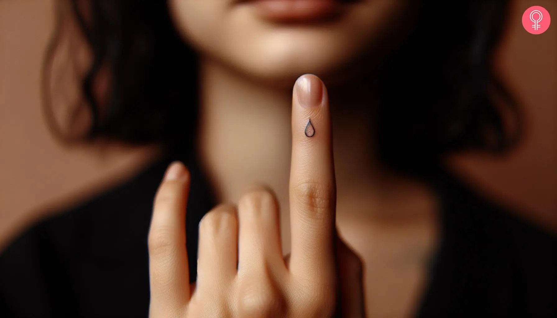 Teardrop tattoo on the finger