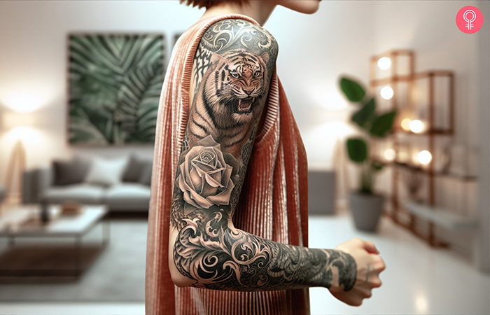 A woman with a tiger rose tattoo on her full sleeve