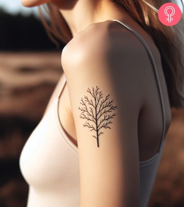 A tree and root tattoo on a woman’s arm