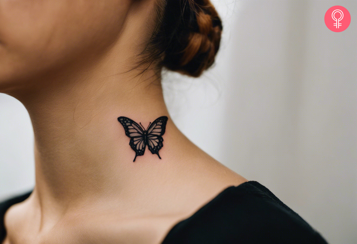 A woman with a traditional black butterfly tattoo on her neck