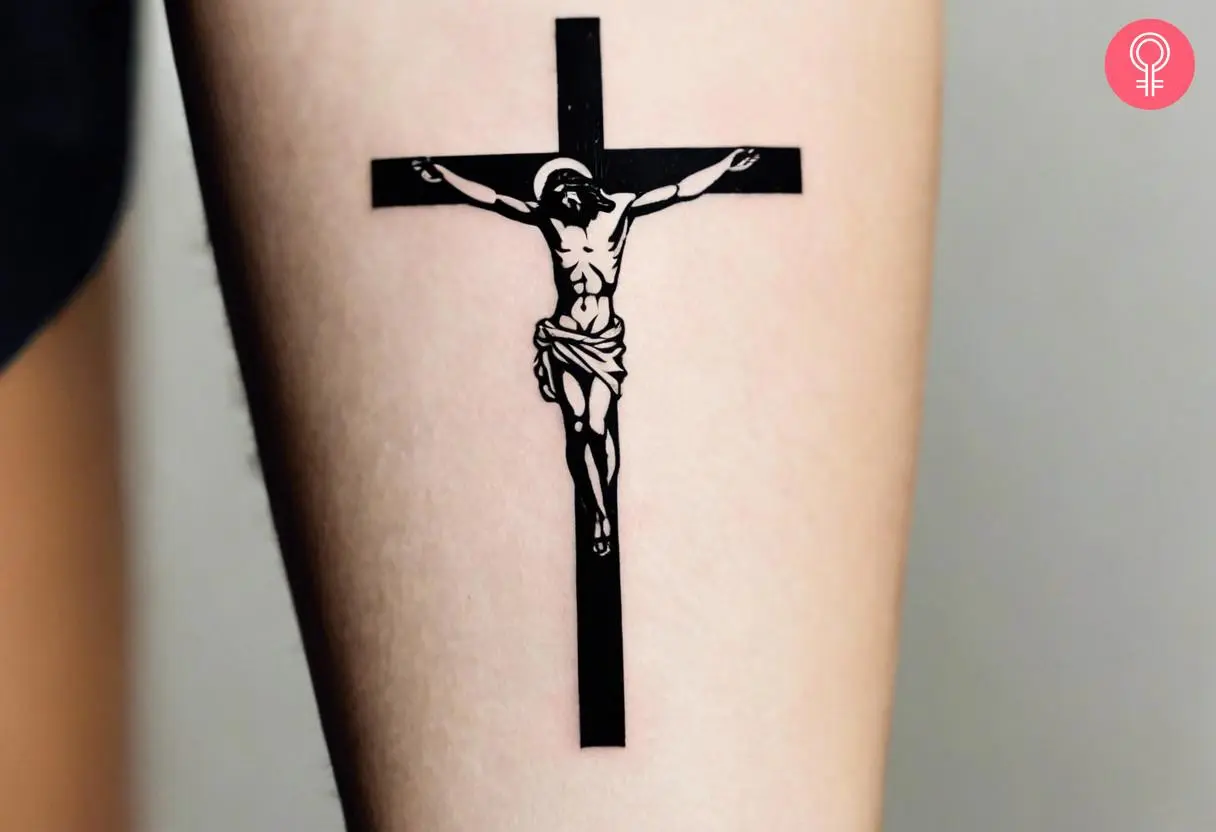 A traditional tattoo of a Jesus inked on the forearm