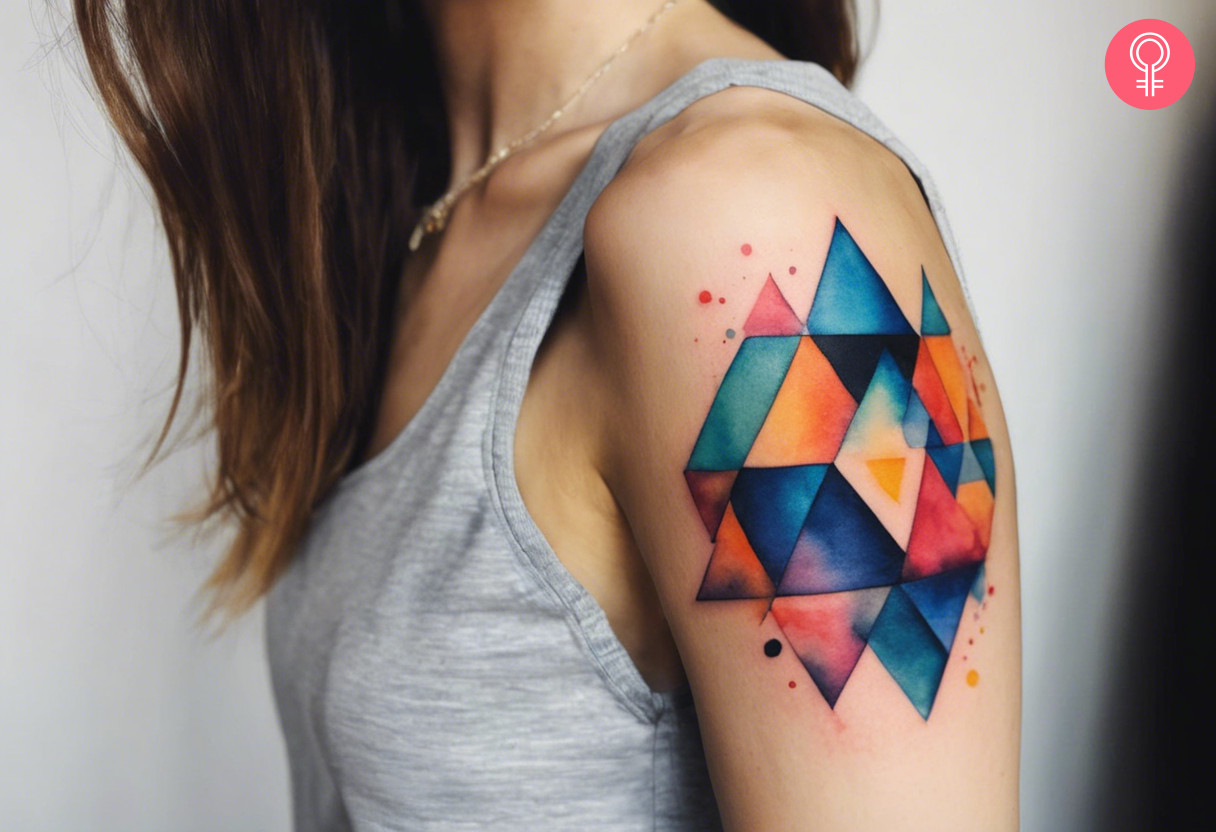 Colorful geometric design tattoo on the upper arm