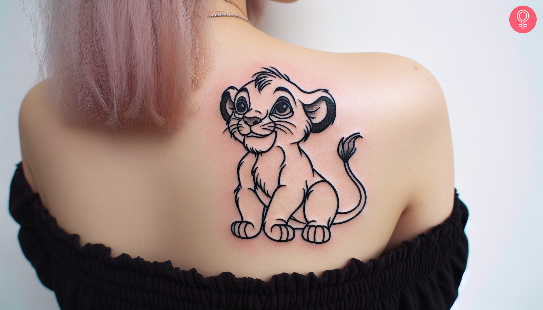 Woman with Disney Simba tattoo on her upper back