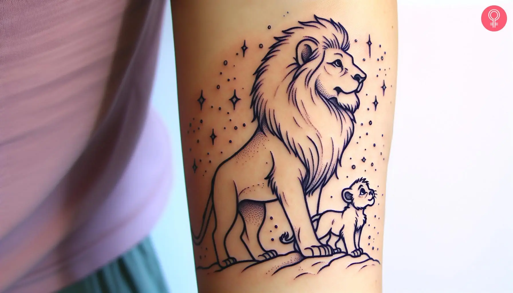 Woman with Mufasa and Simba tattoo on her arm