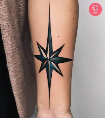 Woman with North Star tattoo on her arm