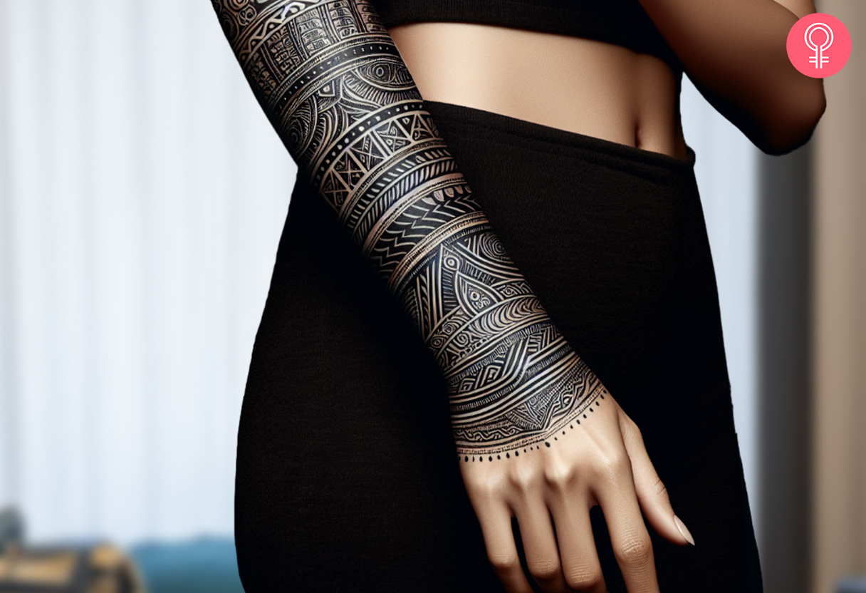 Woman with a Kalinga half-sleeve tattoo.