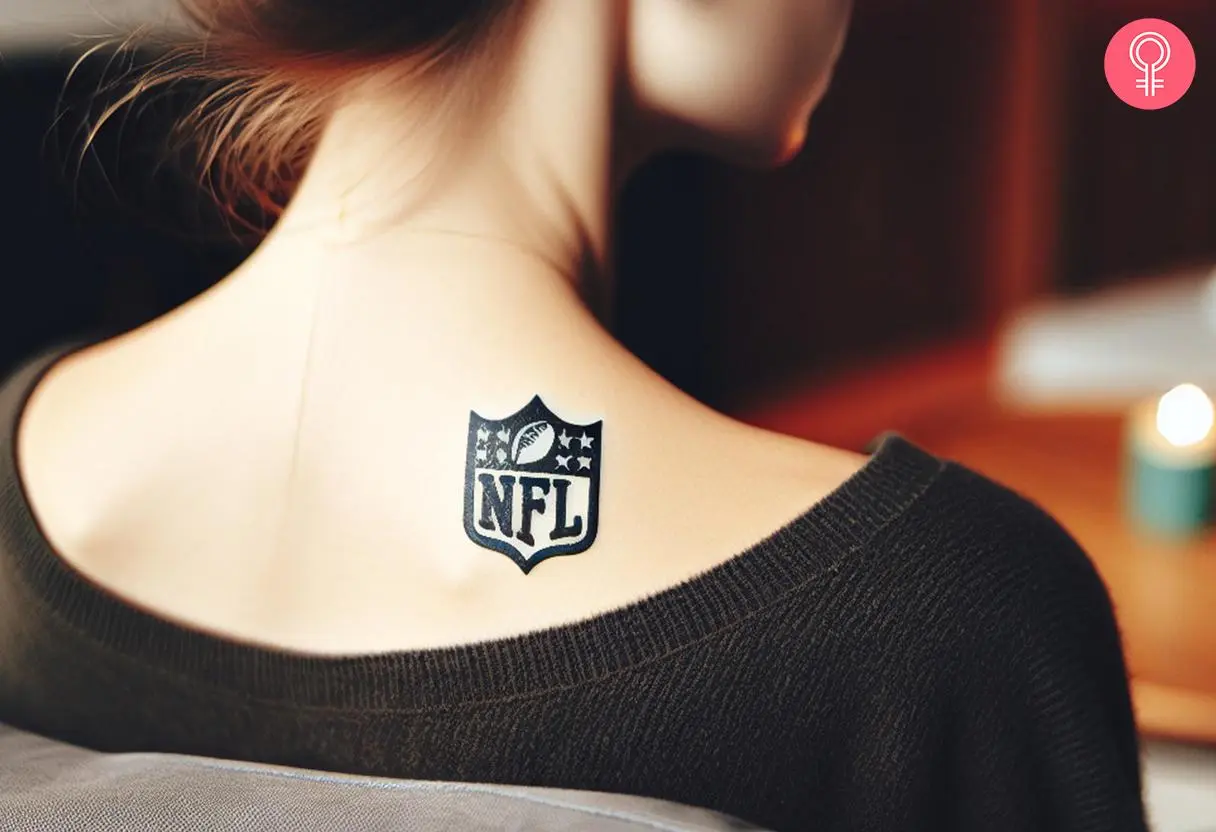 Woman with a NFL logo tattoo on the back