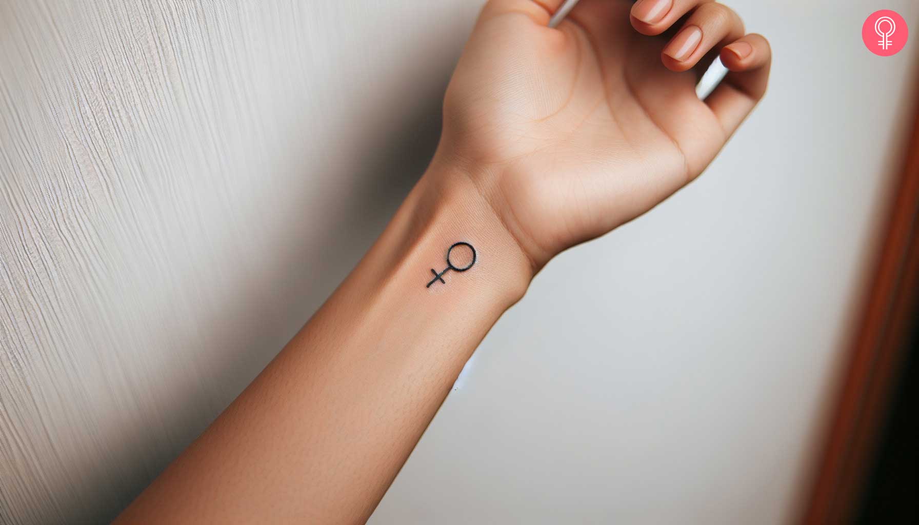 Woman with a Venus symbol tattoo