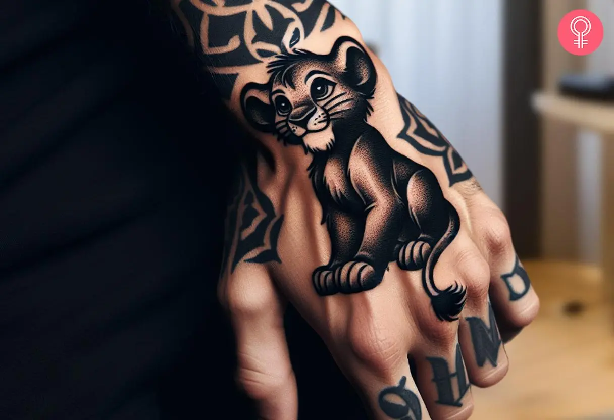 Woman with black Simba tattoo on her hand