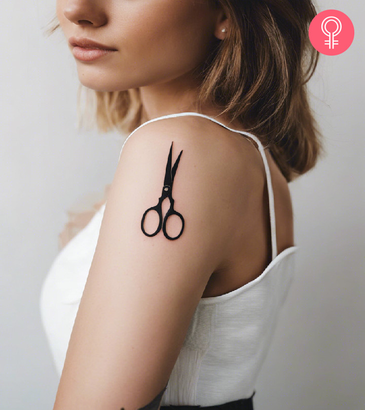 Woman with scissors tattoo on her arm