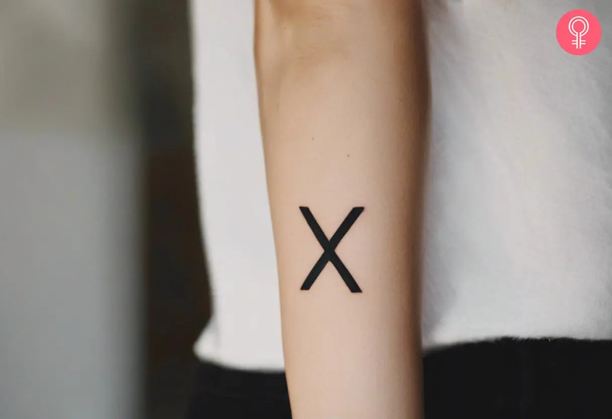 X tattoo on a woman’s forearm