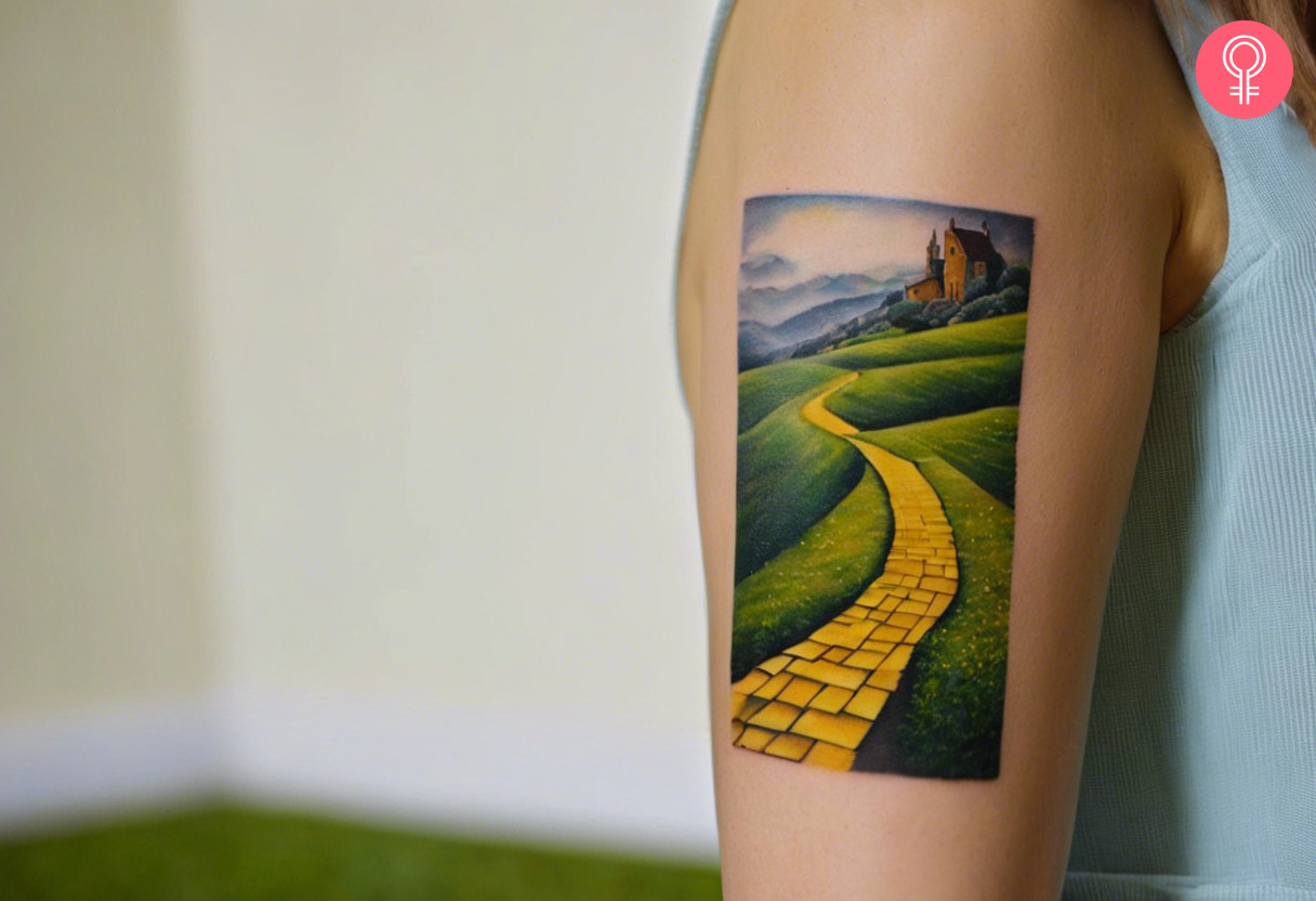 A realistic brick wall path tattoo on the upper arm