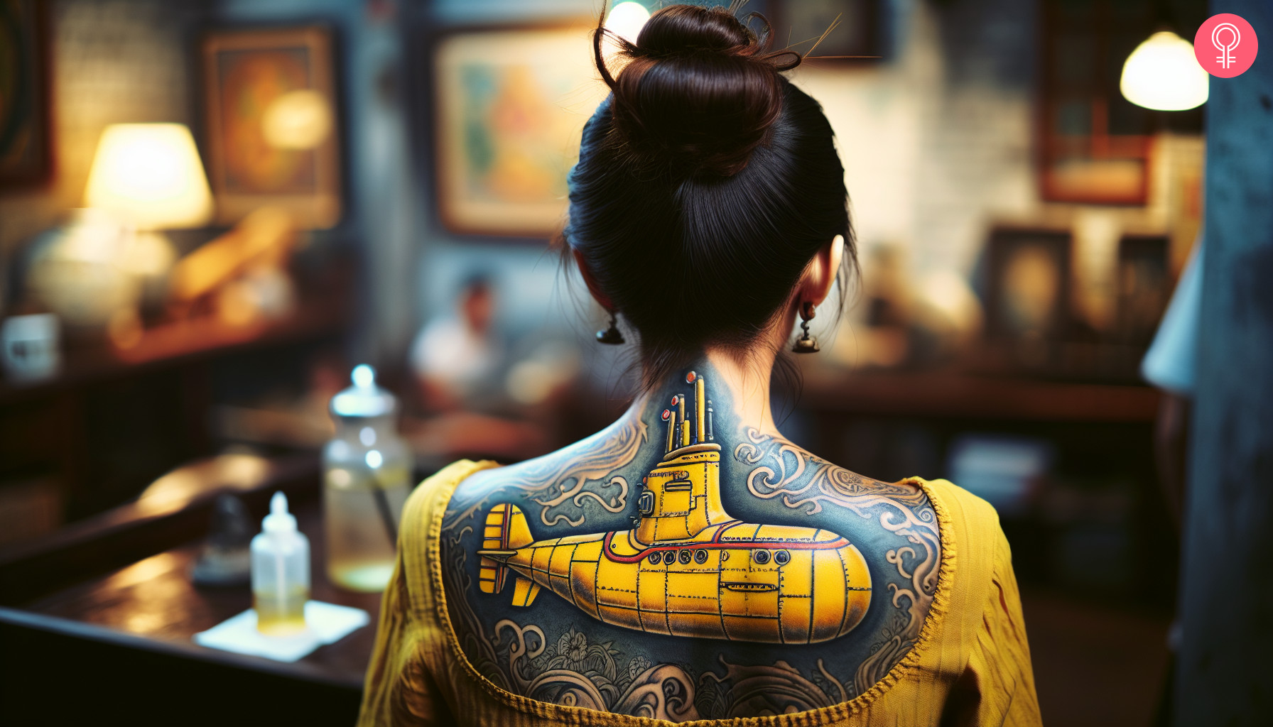 A woman with a vibrant yellow submarine tattoo on her upper back