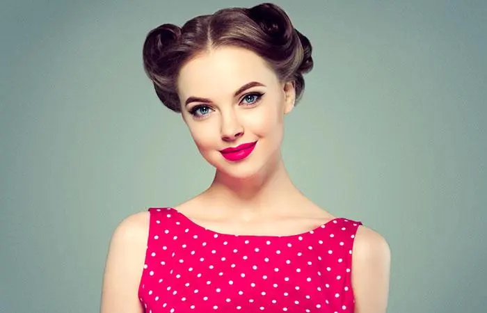 A woman with a 1940s pinned updo hairstyle