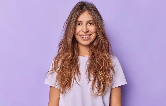 A woman sporting a simple messy grunge hairstyle