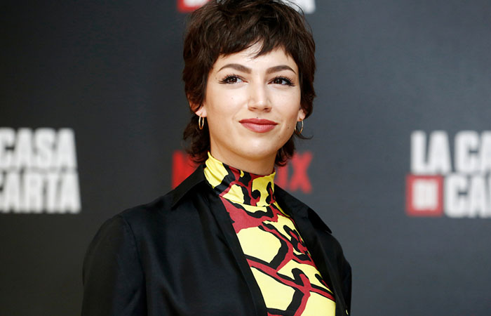 A face-framing long pixie cut that covers the nape