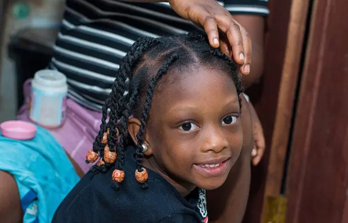 A kid with a twist hairstyle